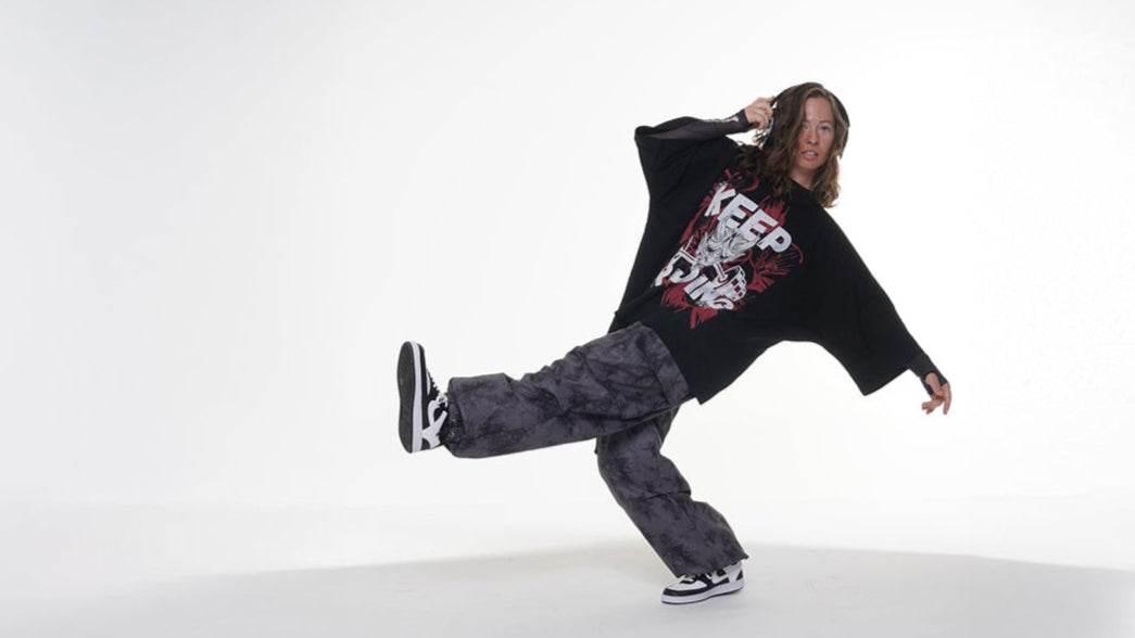 Yelsh Street Model  in gym hipohop danver outfit and gray pants dancing on a white background